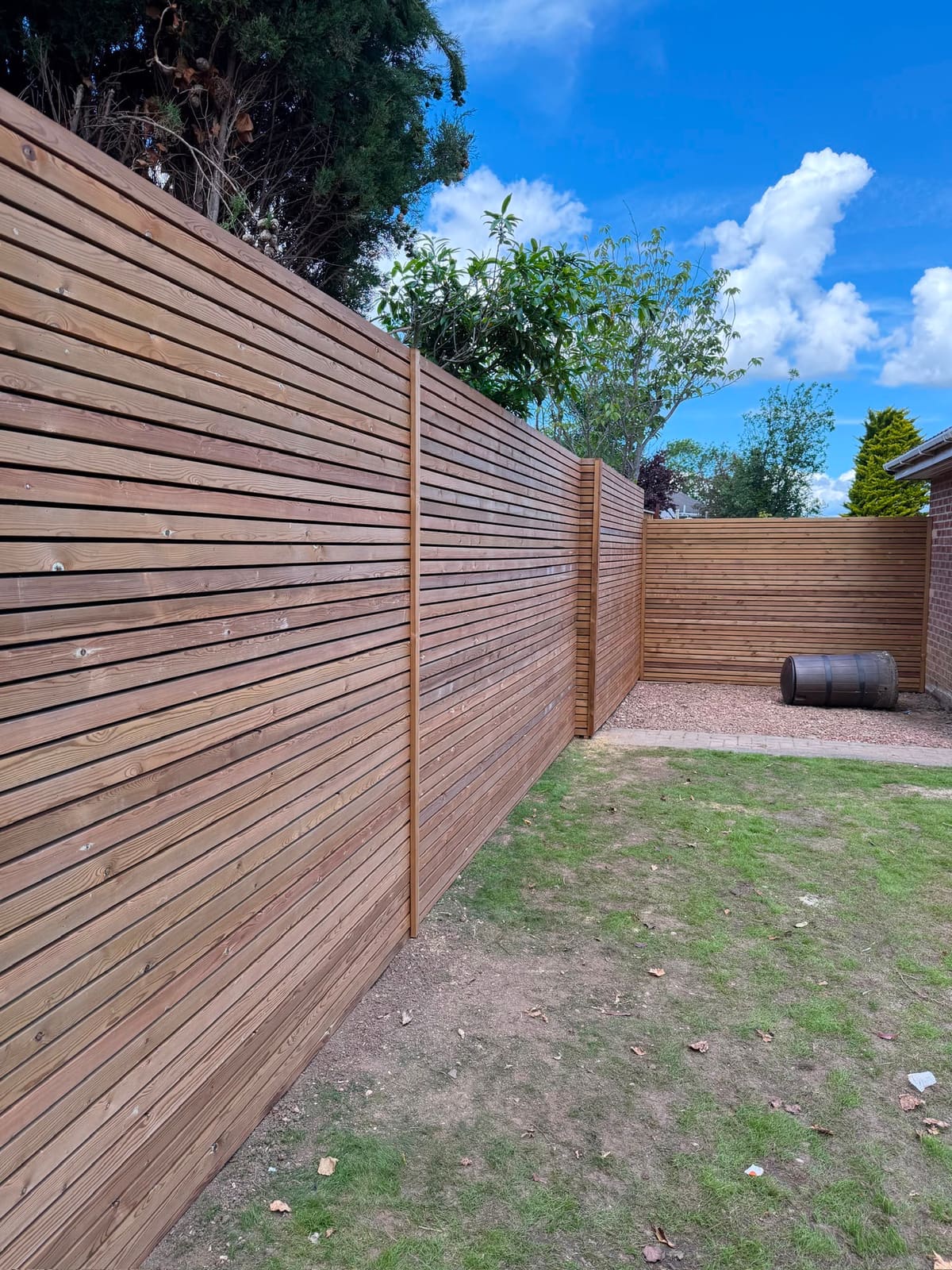 The Venetian fence running the length of the lawn
